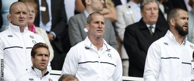 England coaches Graham Rowntree, Stuart Lancaster and Andy Farrell sing the national anthem ahead of the warm-up Test against Ireland