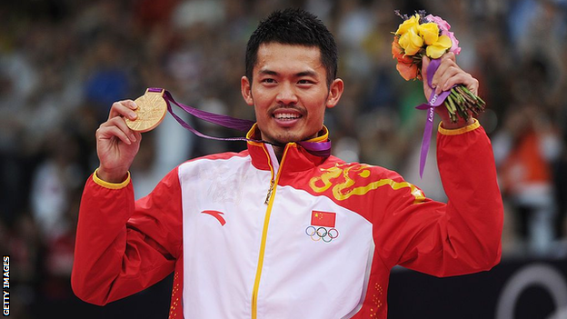 Lin Dan holds his London 2012 gold medal aloft