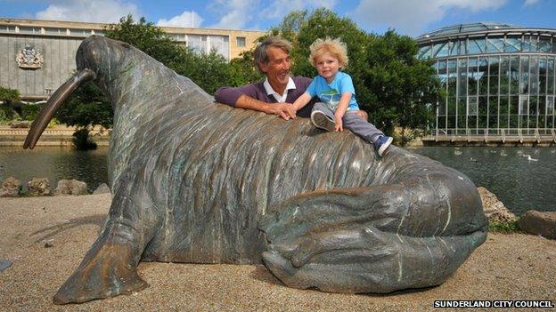 Visitors enjoy the walrus sculpture in Sunderland