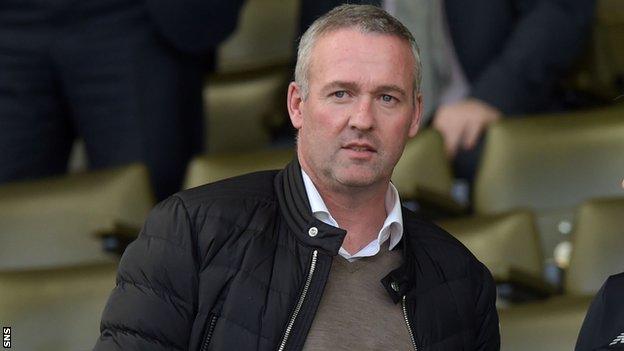 Paul Lambert watches an Old Firm game last season