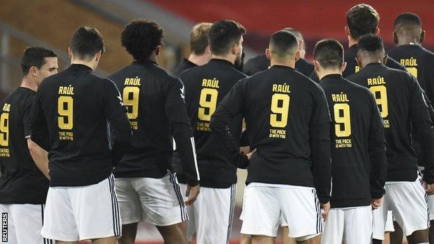 Wolves players warm up wearing T-shirts with messages of support for Raul Jimenez