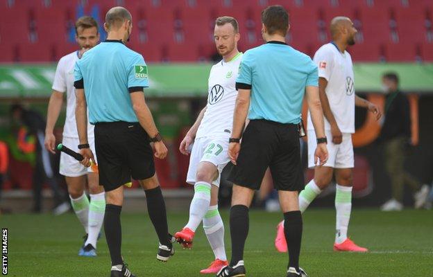 Wolfsburg players kicked boots with the officials afterwards