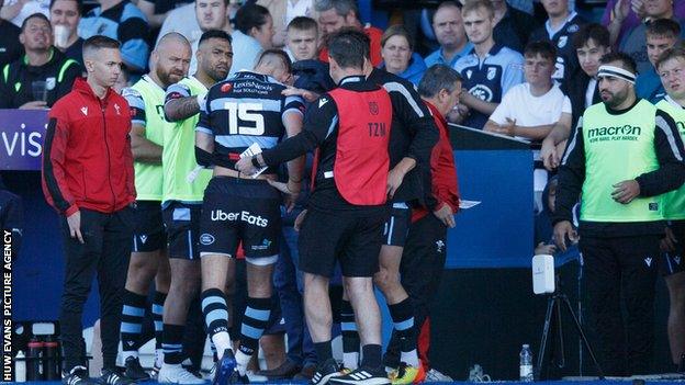 Liam Williams leaves the field against Munster