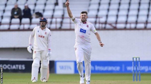 Somerset seamer Craig Overton celebrates taking a wicket against Essex