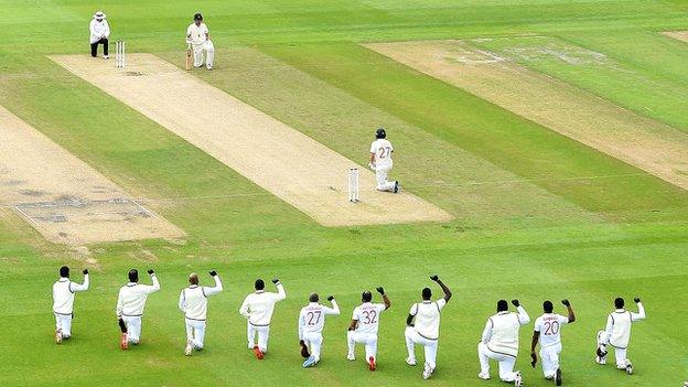 England and the West Indies take a knee before the start of a Test match