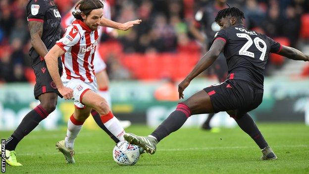 Joe Allen carries the ball forward for Stoke City