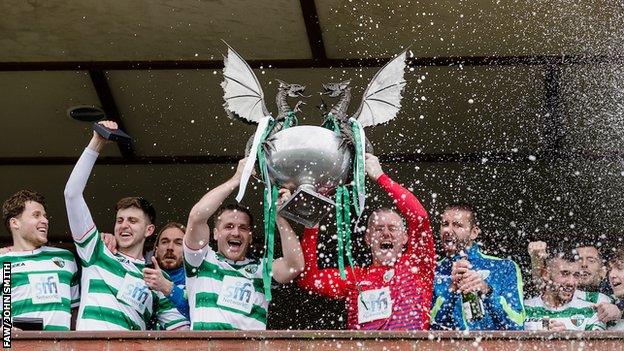 The New Saints players celebrate with the Cymru Premier trophy