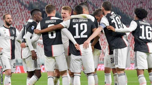 Juventus players celebrate a goal against Inter Milan