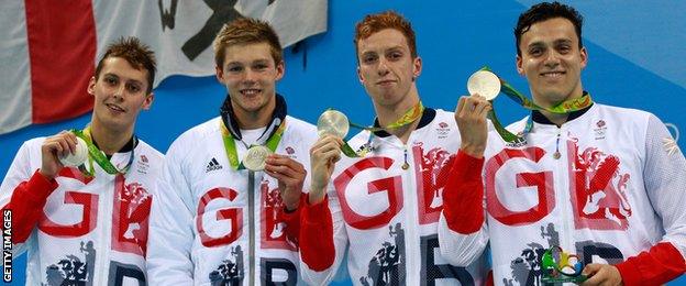 Dan Wallace (second from the right) poses with (l to r) Stephen Milne, Duncan Scott and James Guy after winning Olympic silver for GB in the 4x200m freestyle relay final in Rio