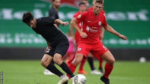 Connah's Quay's Danny Harrison battles for possession