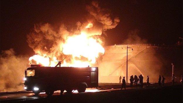 Fire blazes from the Aden oil refinery following a reported shelling attack by Houthi rebels on 13 July 2015