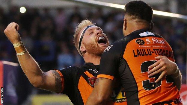 Oliver Holmes celebrates his try for Castleford