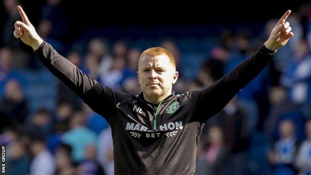 Hibernian manager Neil Lennon salutes the visiting fans at Ibrox