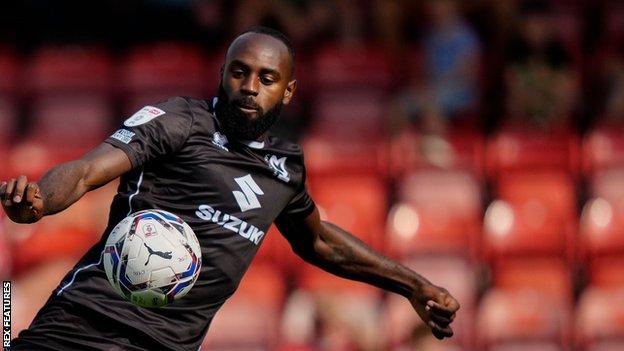 Hiram Boateng in action for MK Dons