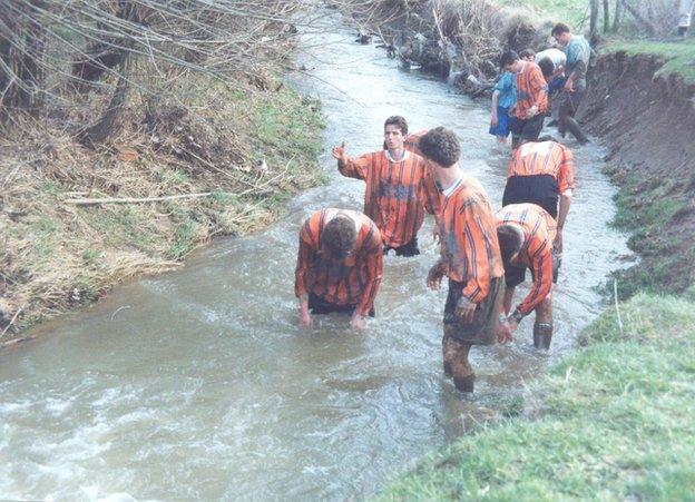 A scene from life in Kosovo's top flight in the 1990s as players wash after a match