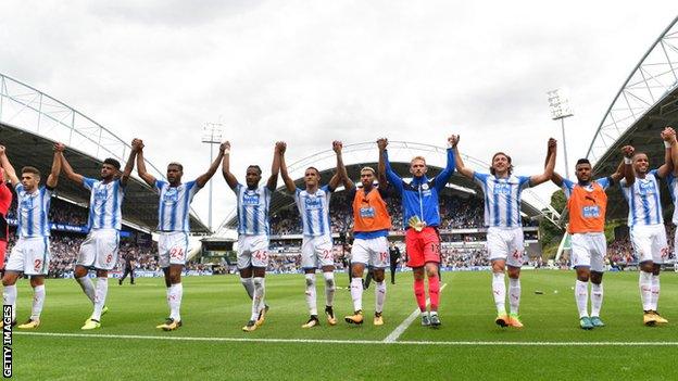 Huddersfield players celebrate after beating Newcastle