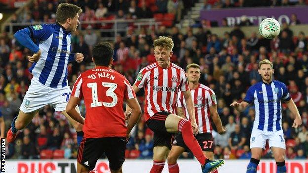 Sheffield Wednesday's Adam Reach heads in