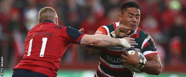 Manu Tuilagi attempts to get past Keith Earls at Thomond Park