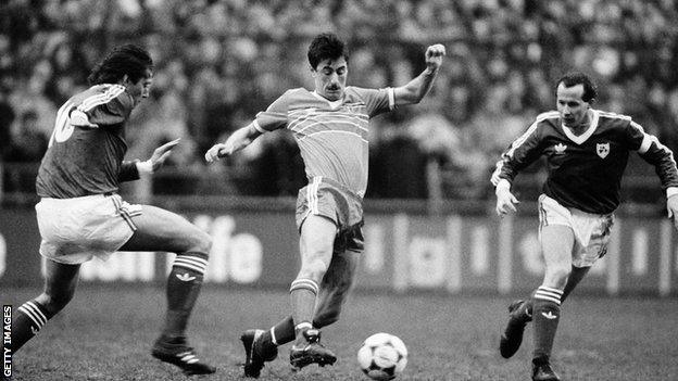 Ian Rush in action against Ireland's Michael Robinson and Liam Brady