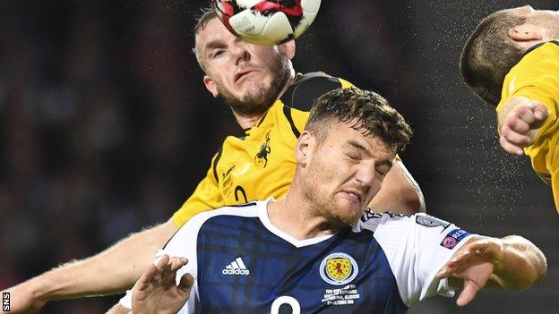 Scotland striker Chris Martin is crowded out by Lithuania's Georgas Freidgeimas (left) and Mantas Kuklys