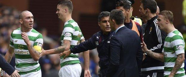 Celtic's Scott Brown exchanges words with Rangers manager Pedro Caixinha at half time