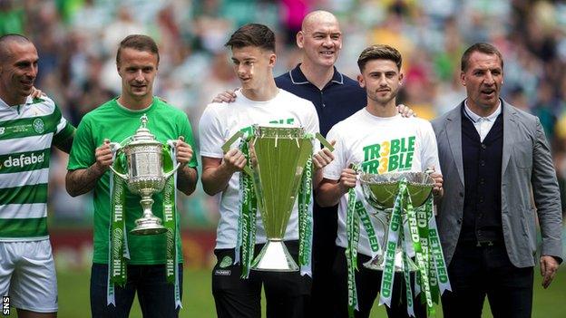 Celtic parade their three trophies