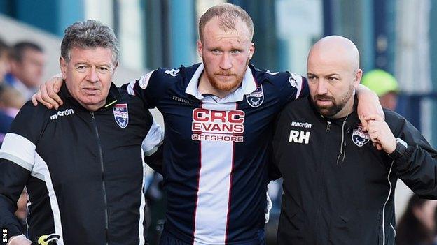 Ross County's Liam Boyce is helped off against St Johnstone