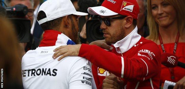 Sebastian Vettel congratulates Lewis Hamilton following his victory