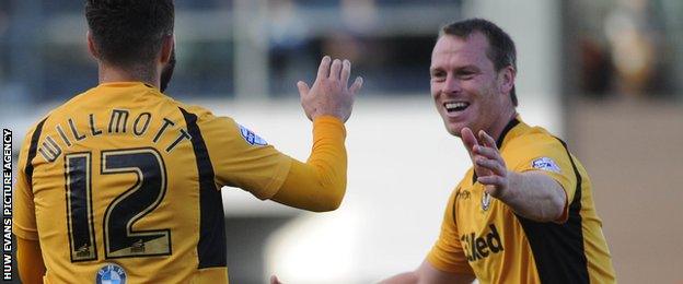 Michael Flynn in his County playing days celebrates a goal with Robbie Willmott