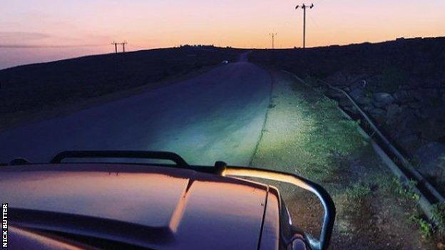 Car bonnet driving at dusk