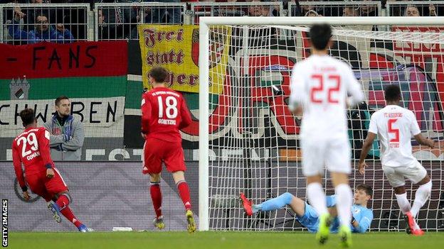 Kingsley Coman celebrates scoring in Bayern Munich's 3-2 victory over Augsburg in the Bundesliga