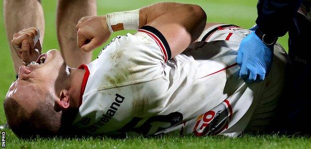 Ulster's Will Addison in agony after turning his ankle in a tackle