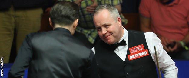 John Higgins and Mark Selby shake hands