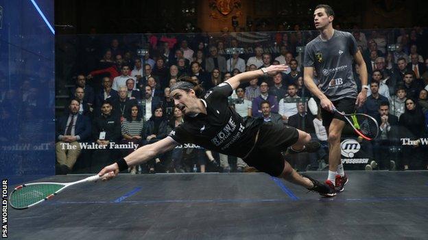 Paul Coll dives to reach a shot against Ali Farag in the British Open final