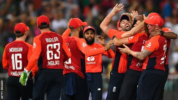 England celebrate their two-run win over South Africa in the second T20