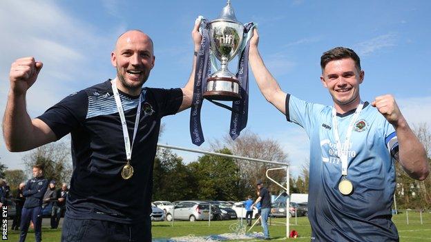 Institute manager Paddy McLaughlin and captain Michael McCrudden with the Championship trophy