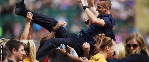 England football coach Mark Sampson is thrown into the air at Women's World Cup