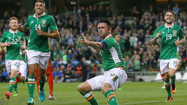 Robbie Keane gives Irish fans a final showing of his trademark celebration after netting against Oman