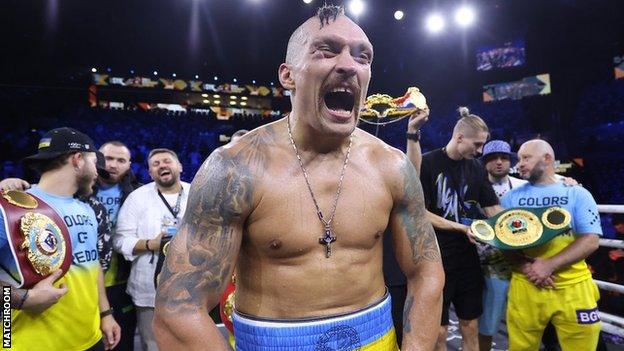 Oleksandr Usyk celebrates