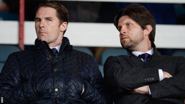 Alan Archibald (left) and his assistant Scott Paterson watch the Dundee v Dundee United match on Monday