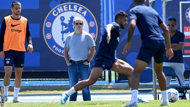 Chelsea co-owner Todd Boehly (centre rear) watches training