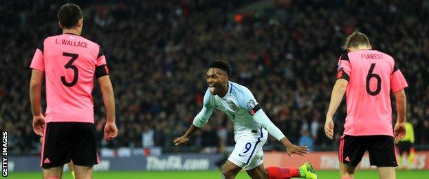 England's Daniel Sturridge celebrates scoring against England