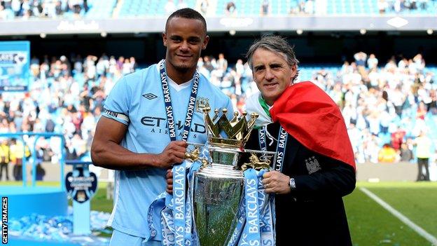 Vincent Kompany and Roberto Mancini lift the Premier League title in 2012