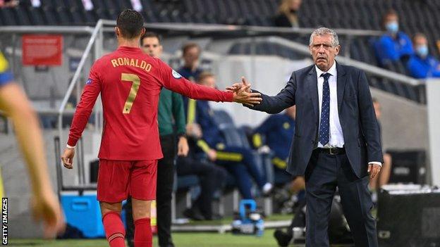 Fernando Santos and Cristiano Ronaldo tap hands