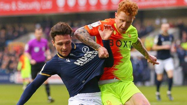 Dan McNamara of Millwall battles for possession with Jack Colback of Nottingham Forest