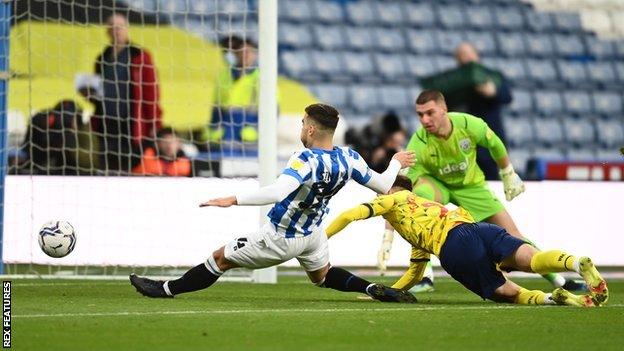 Danel Sinani opens the scoring for Huddersfield against West Brom