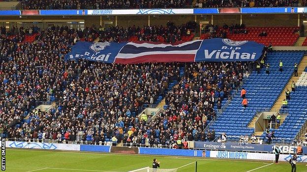 Cardiff fans hold aloft a banner