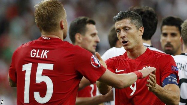 Poland's Kamil Glik (left) and Robert Lewandowski