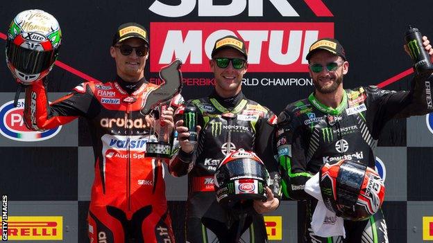 Rea (centre) is flanked by rivals Chaz Davies and Tom Sykes