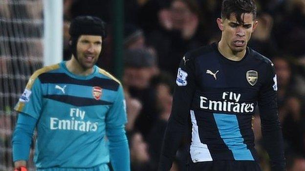 Petr Cech and Gabriel look dejected after Norwich's goal